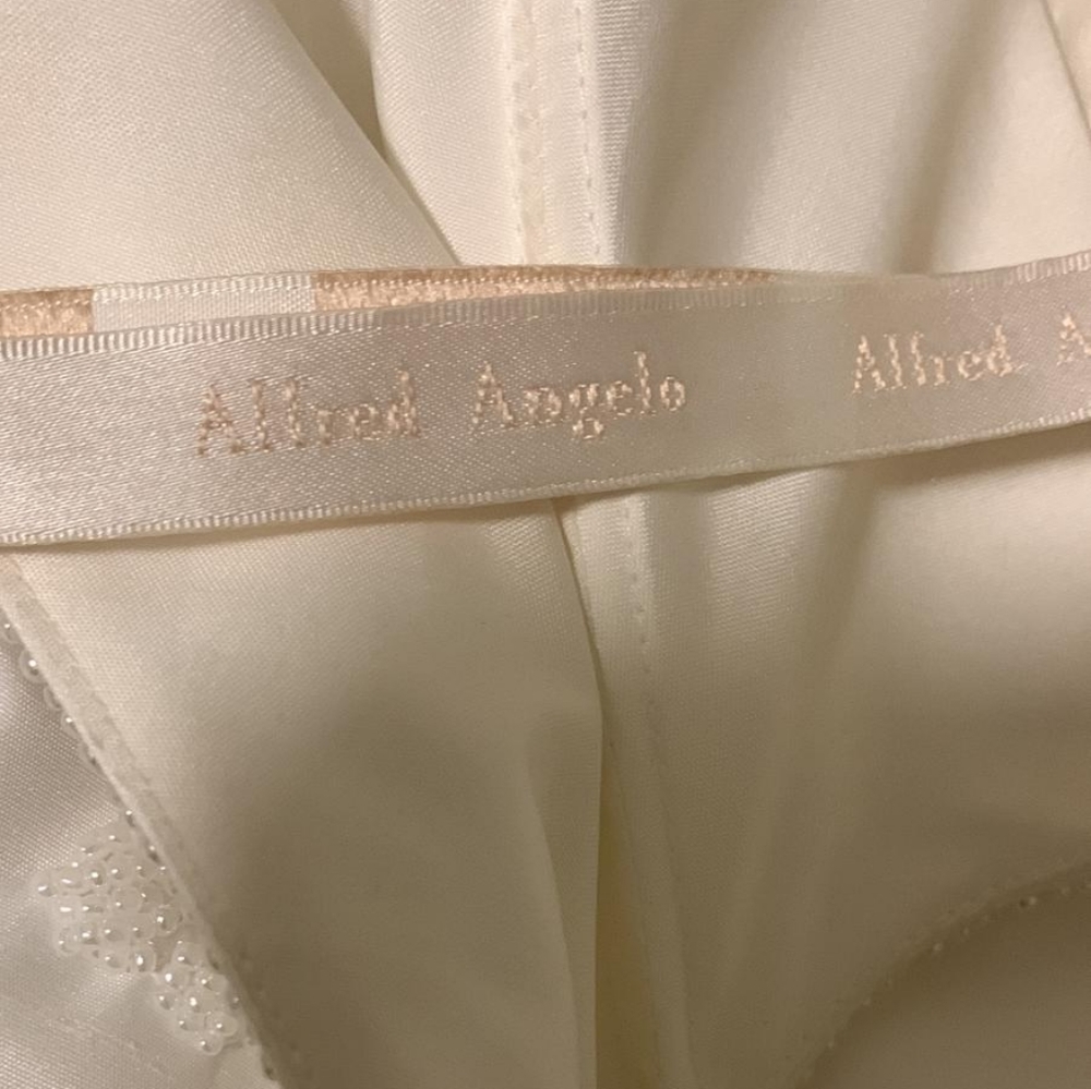 Wedding gown by Alfred Anjelo